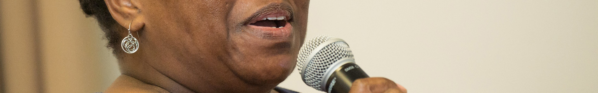 Close-up of person speaking into microphone