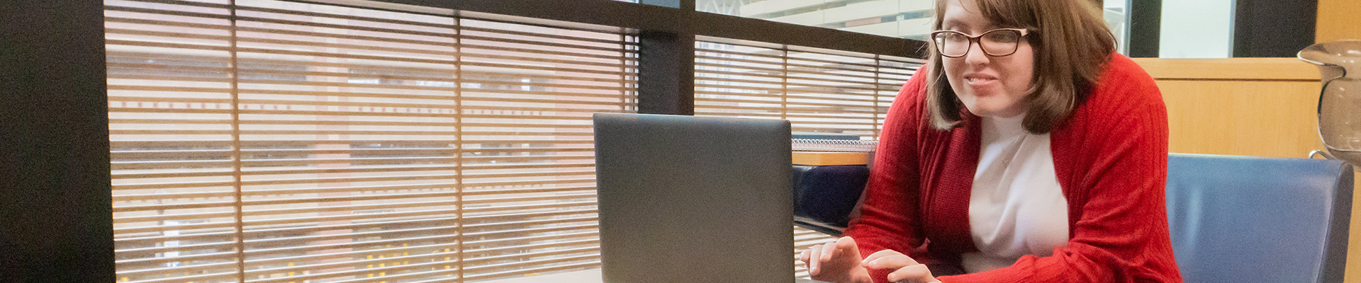 Woman typing on a laptop