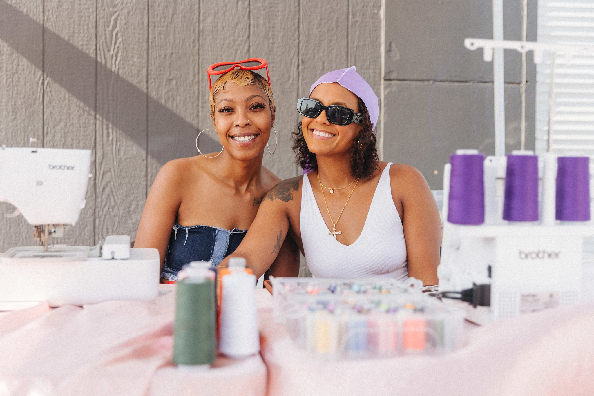 Two young people at a sewing event.