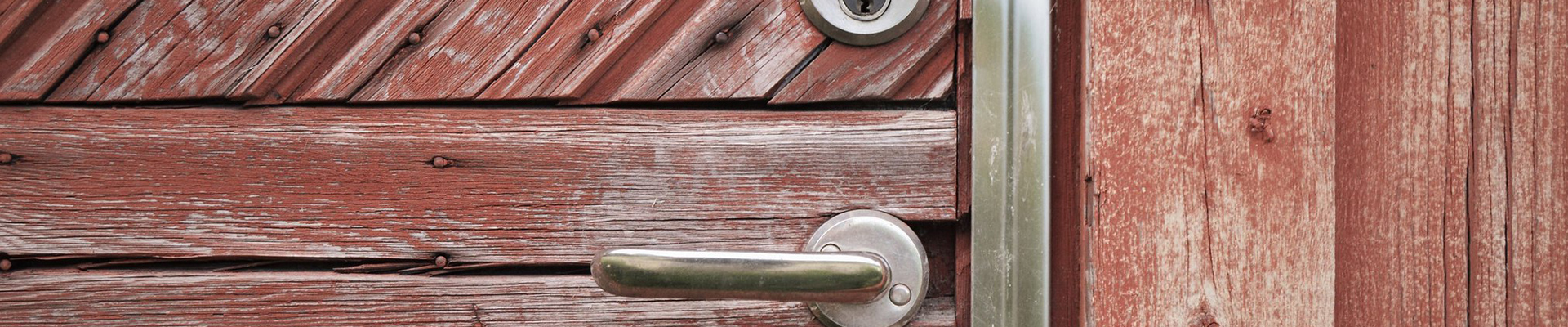 Close-up of a handle on a wood door