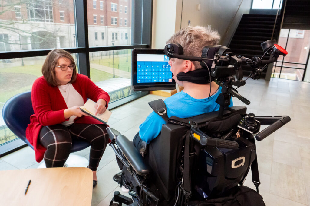 A young wheelchair user being interviewed.