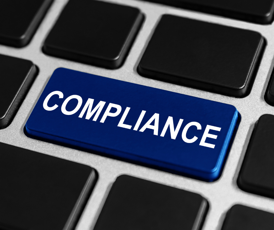 Blue keyboard key labeled "Compliance."