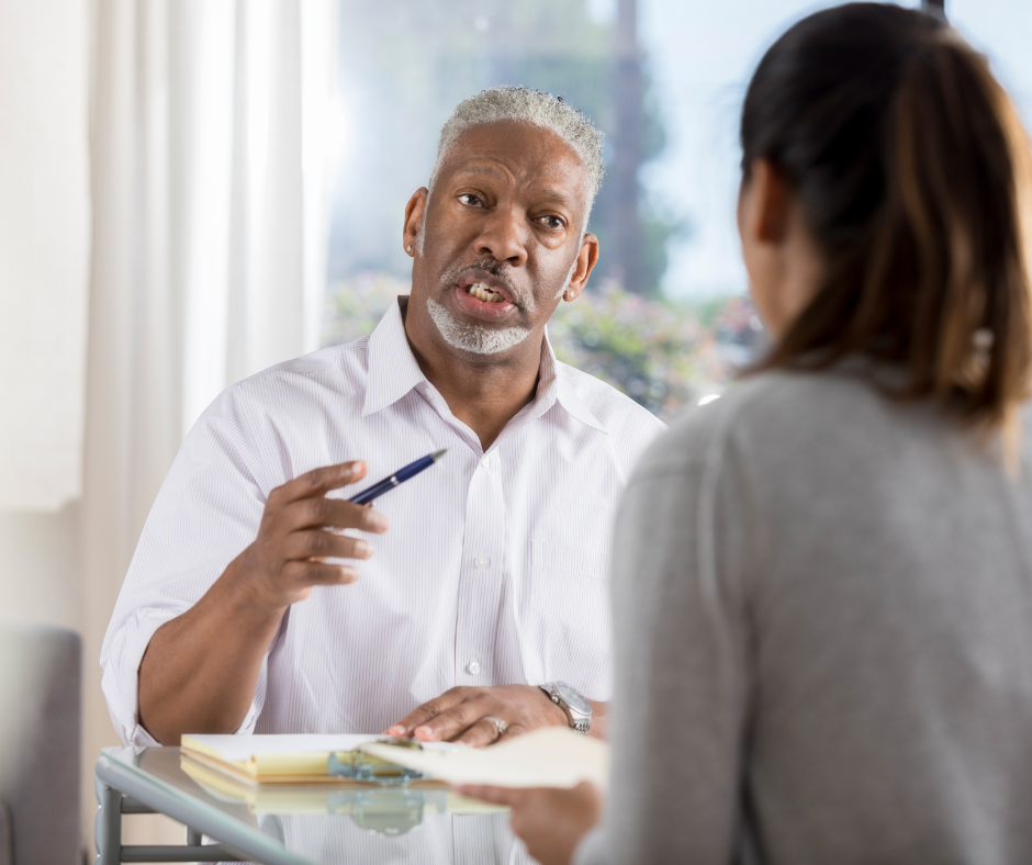 Professional speaking with a client during an intake meeting.