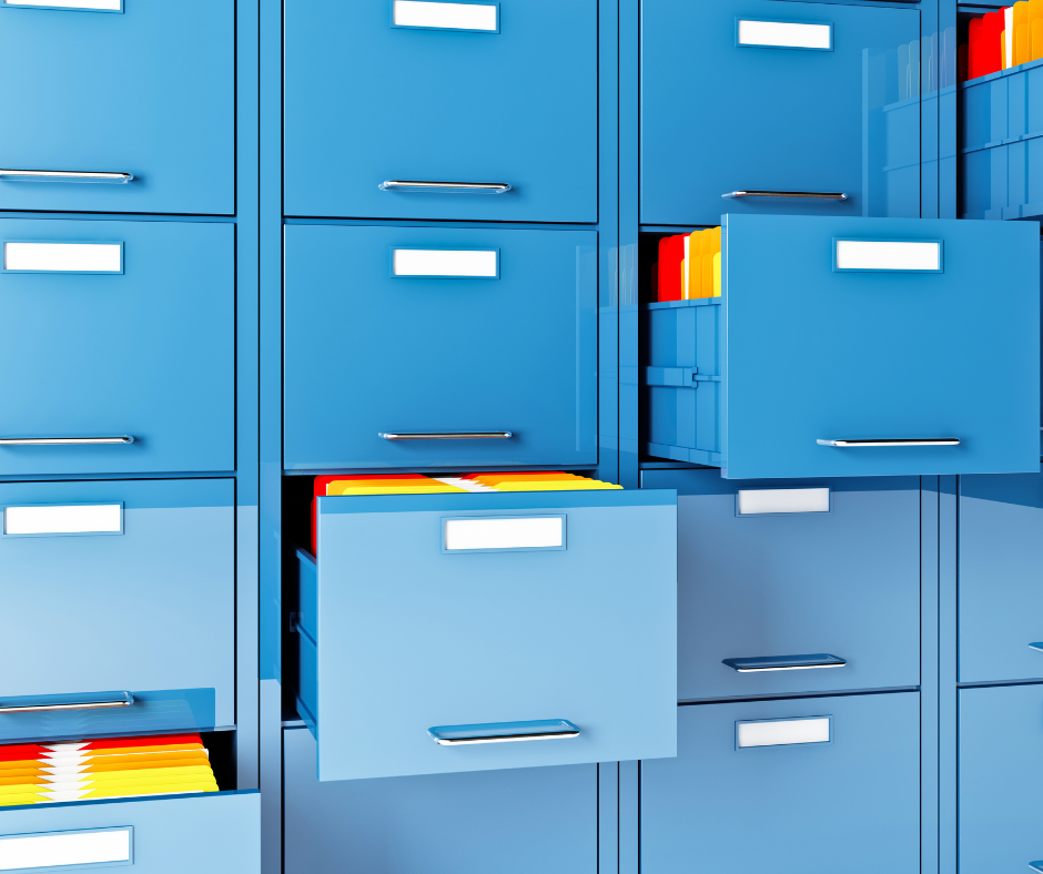 Open filing cabinet drawers containing organized file folders.