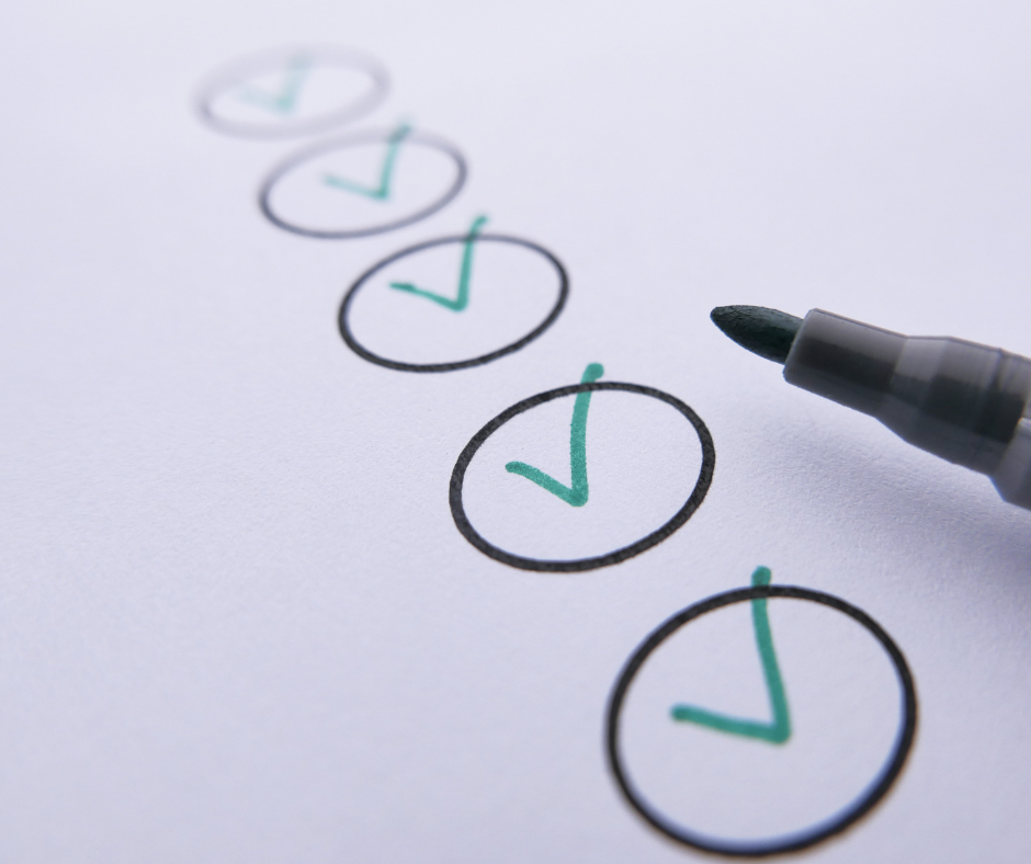 Checklist with completed checkmarks and a marker.